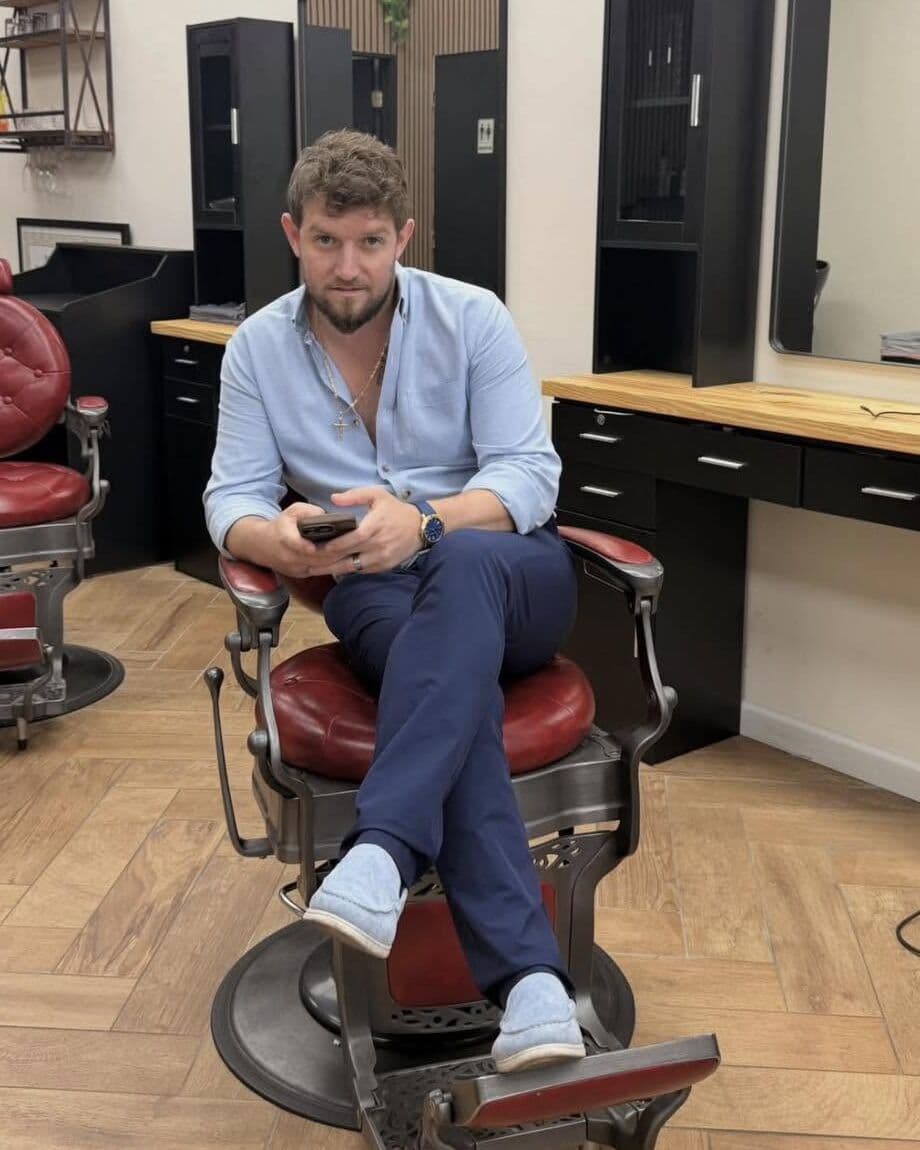 Andy Peto, the owner, in one of the shop's red barber chairs
