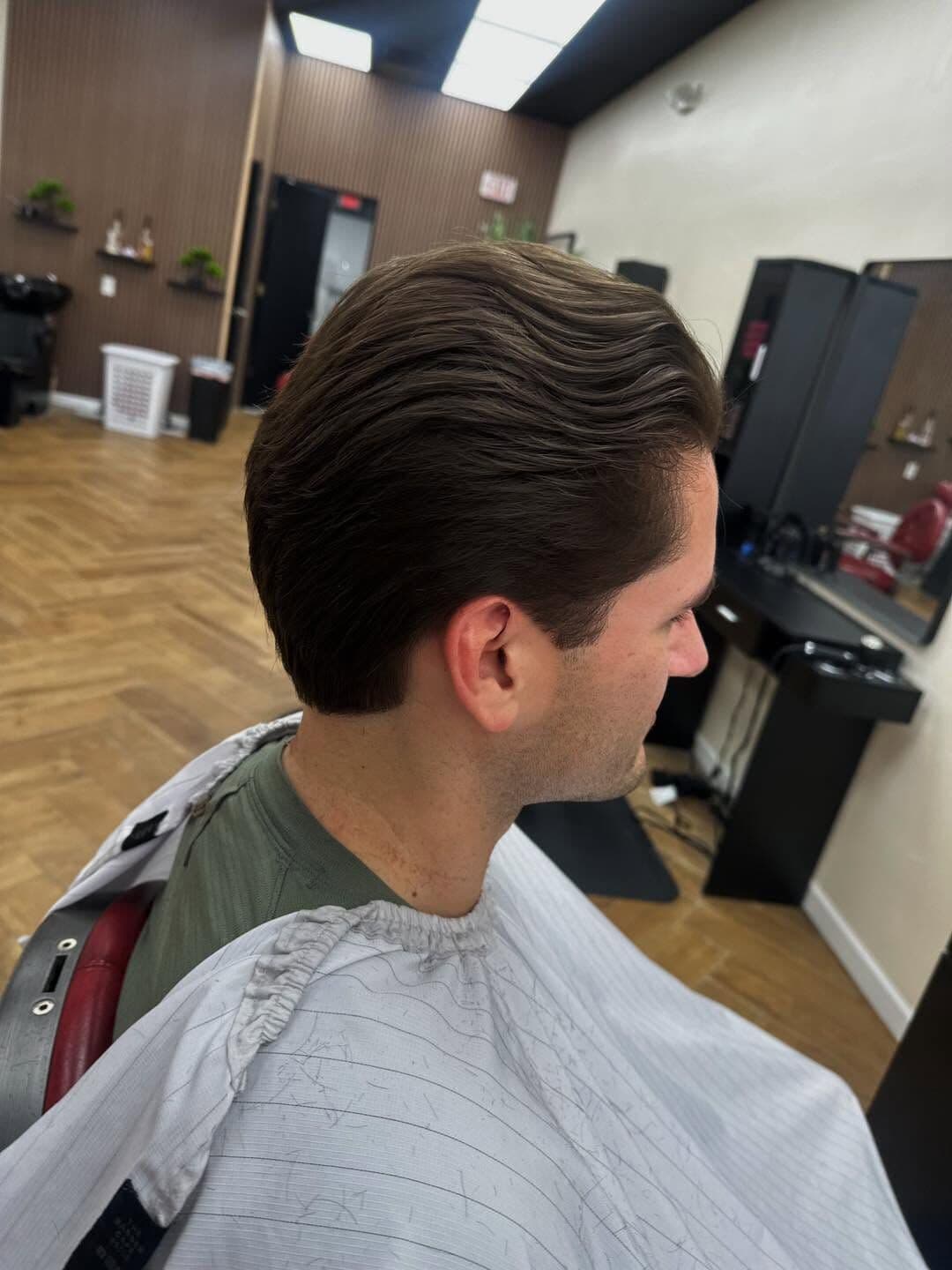 A classic slicked-back cut with a tapered neckline, seen from behind
